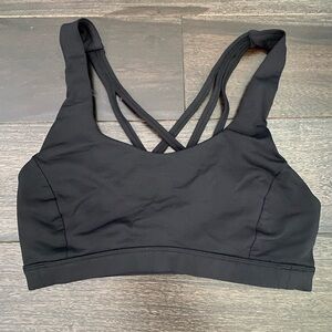 Size 6 Lululemon black sports bra with cute straps in back